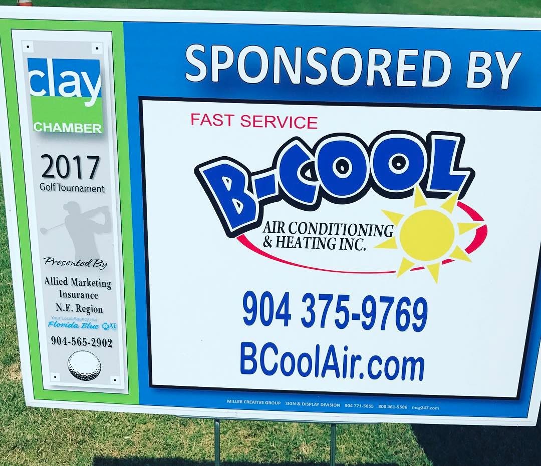 A Clay Chamber golf tournament sponsor board listing B-Cool Air Conditioning & Heating among the sponsors