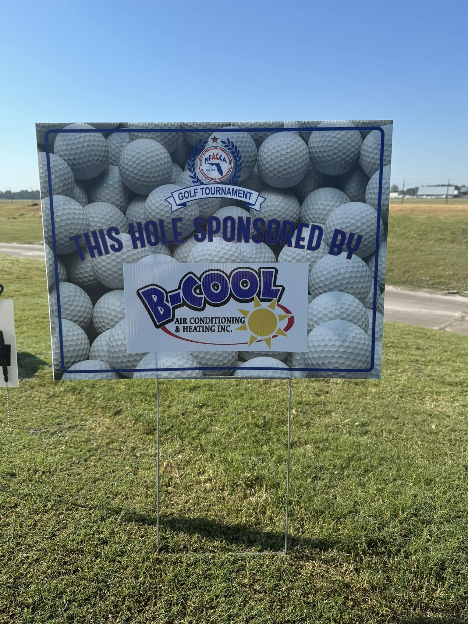 A North Florida Air Conditioning Contractors Association golf tournament sign reading “This hole sponsored by B-Cool Air